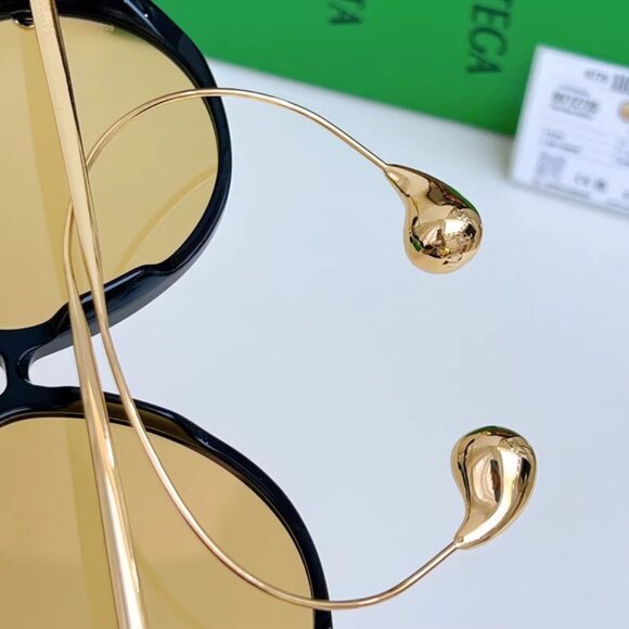 ? Bottega Veneta Black and Gold Sunglasses